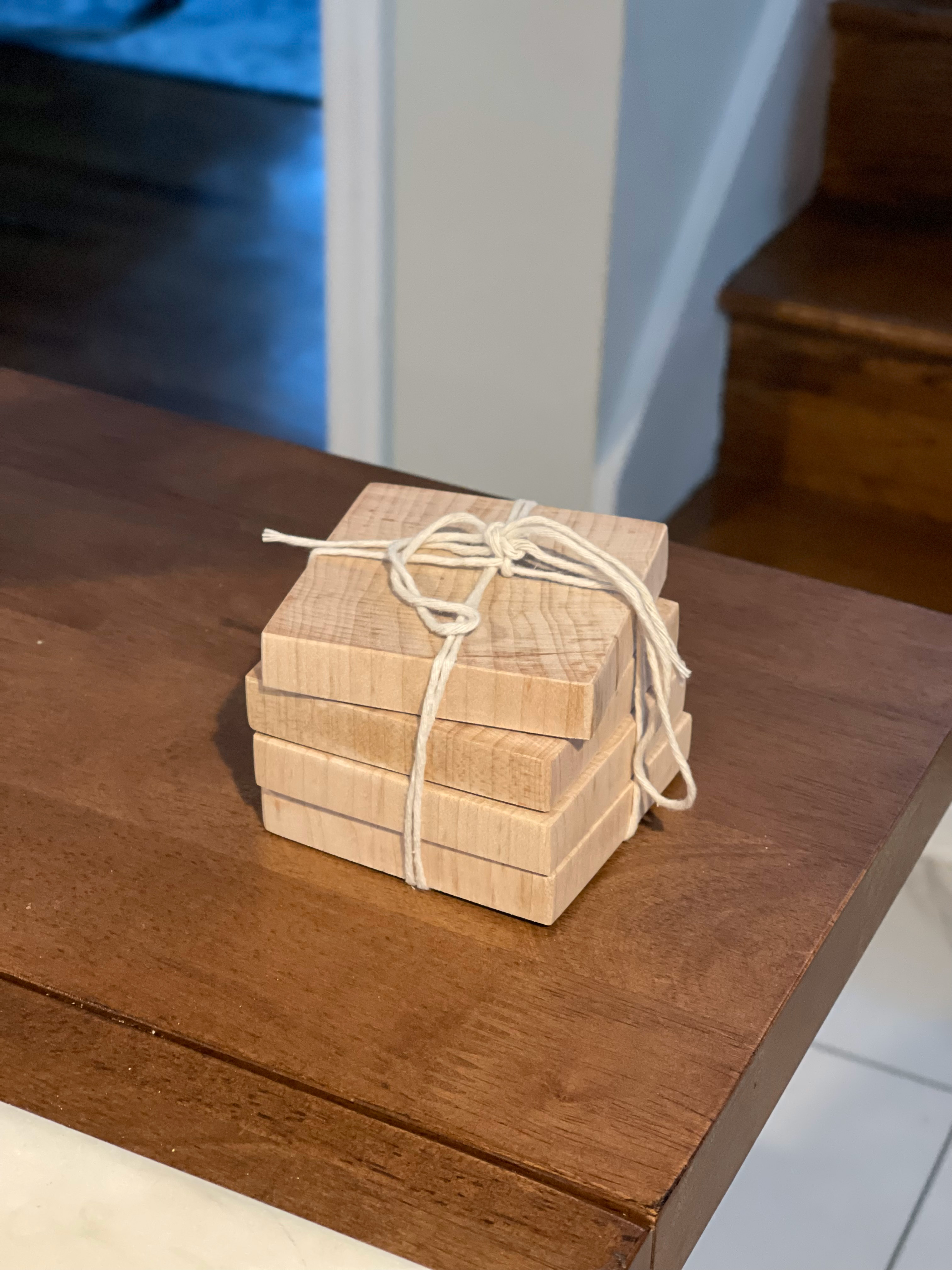 Set of four maple coasters wrapped in twine
