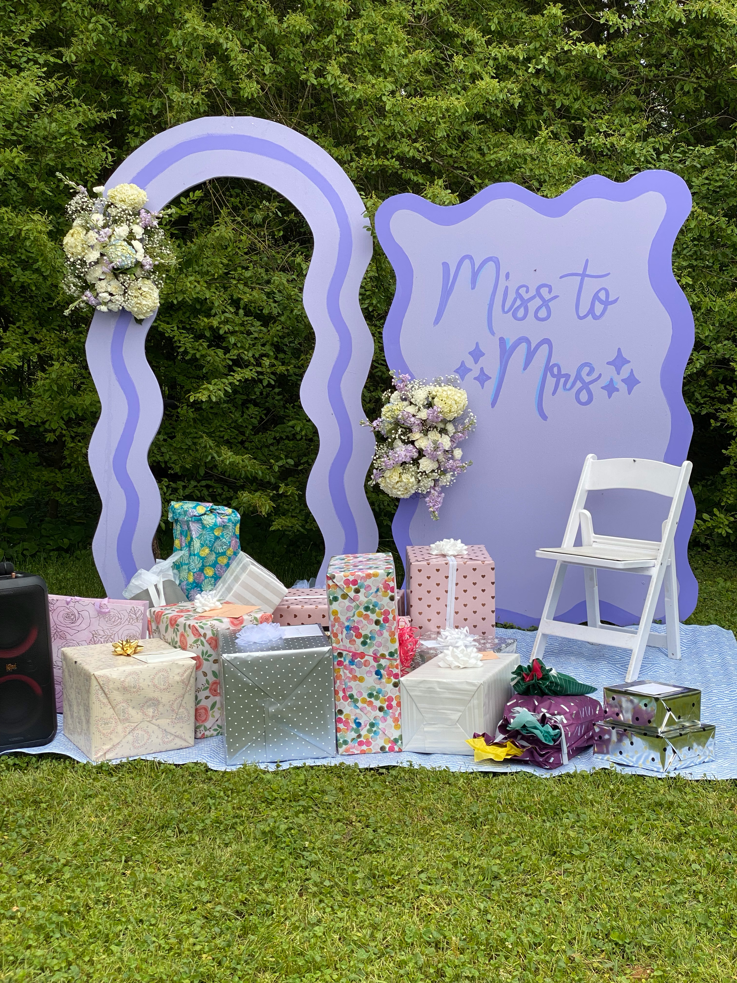 Painted and decorated wavy MDF arch and sign